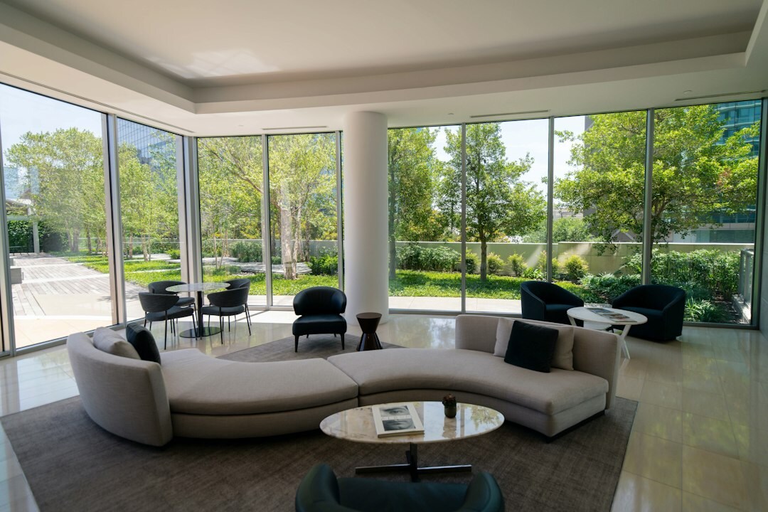 Elegant villa living room with large windows and modern furniture