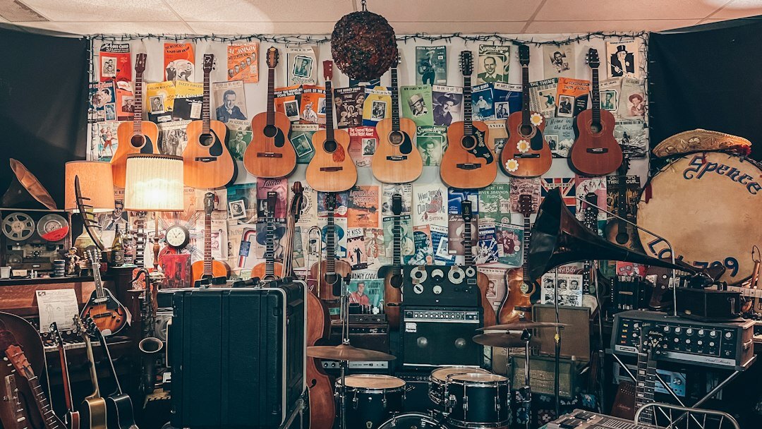 Home music recording studio with mixing console and vintage guitars